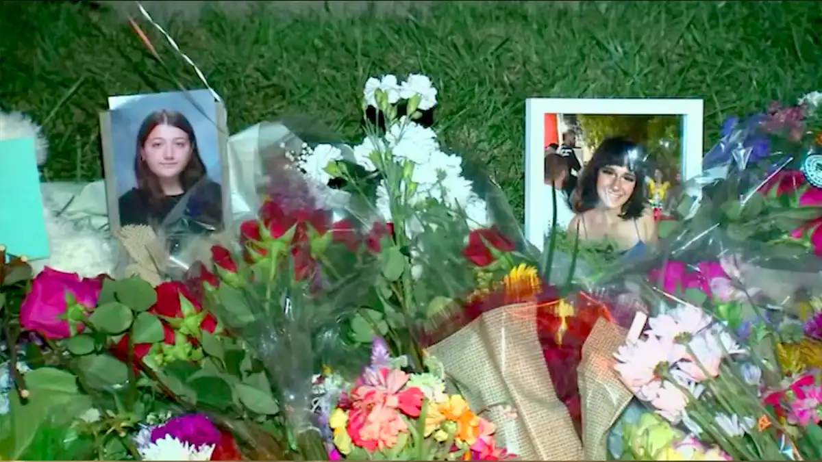 A vigil is held for two teens